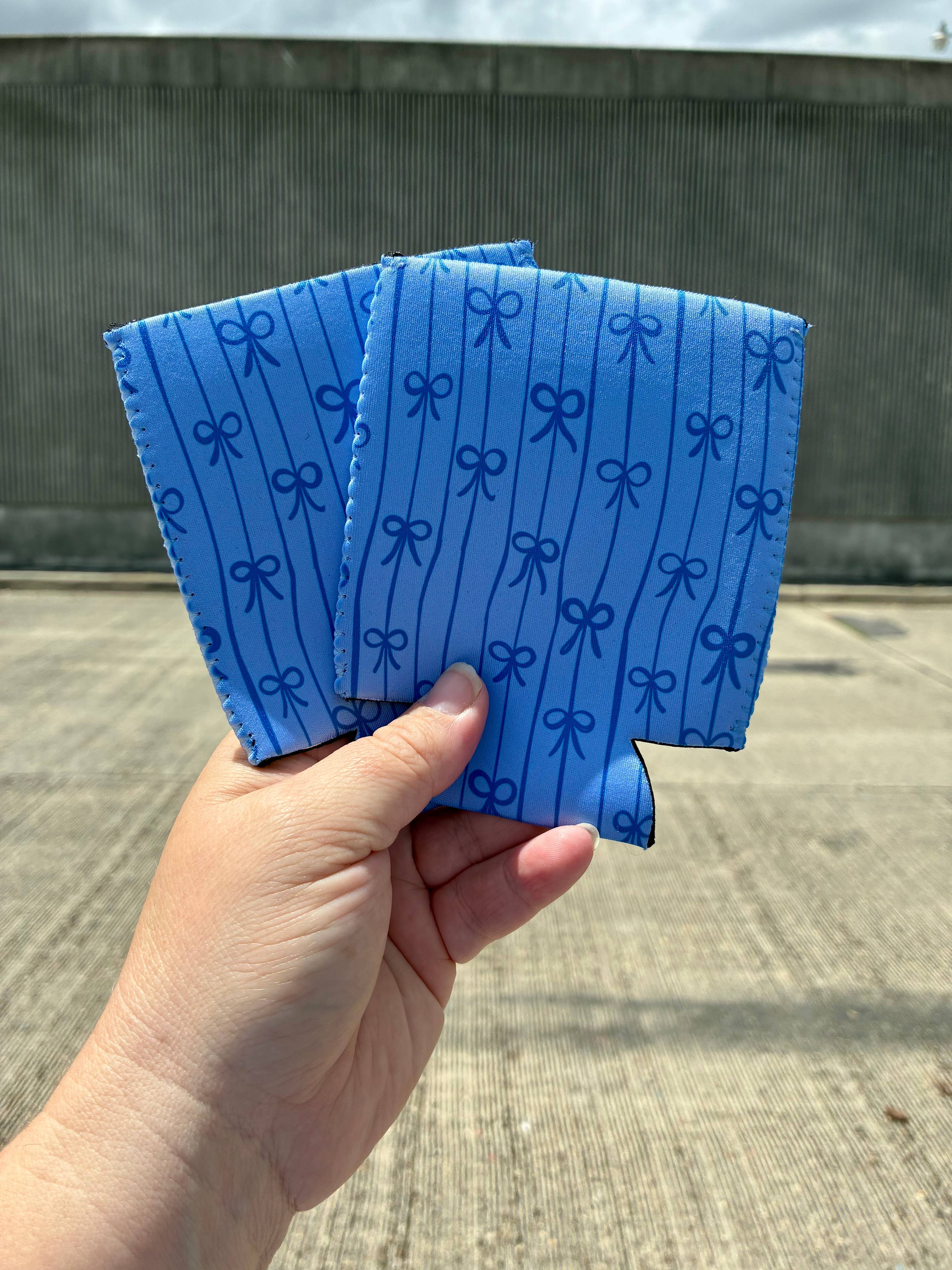 Blue bow can koozies