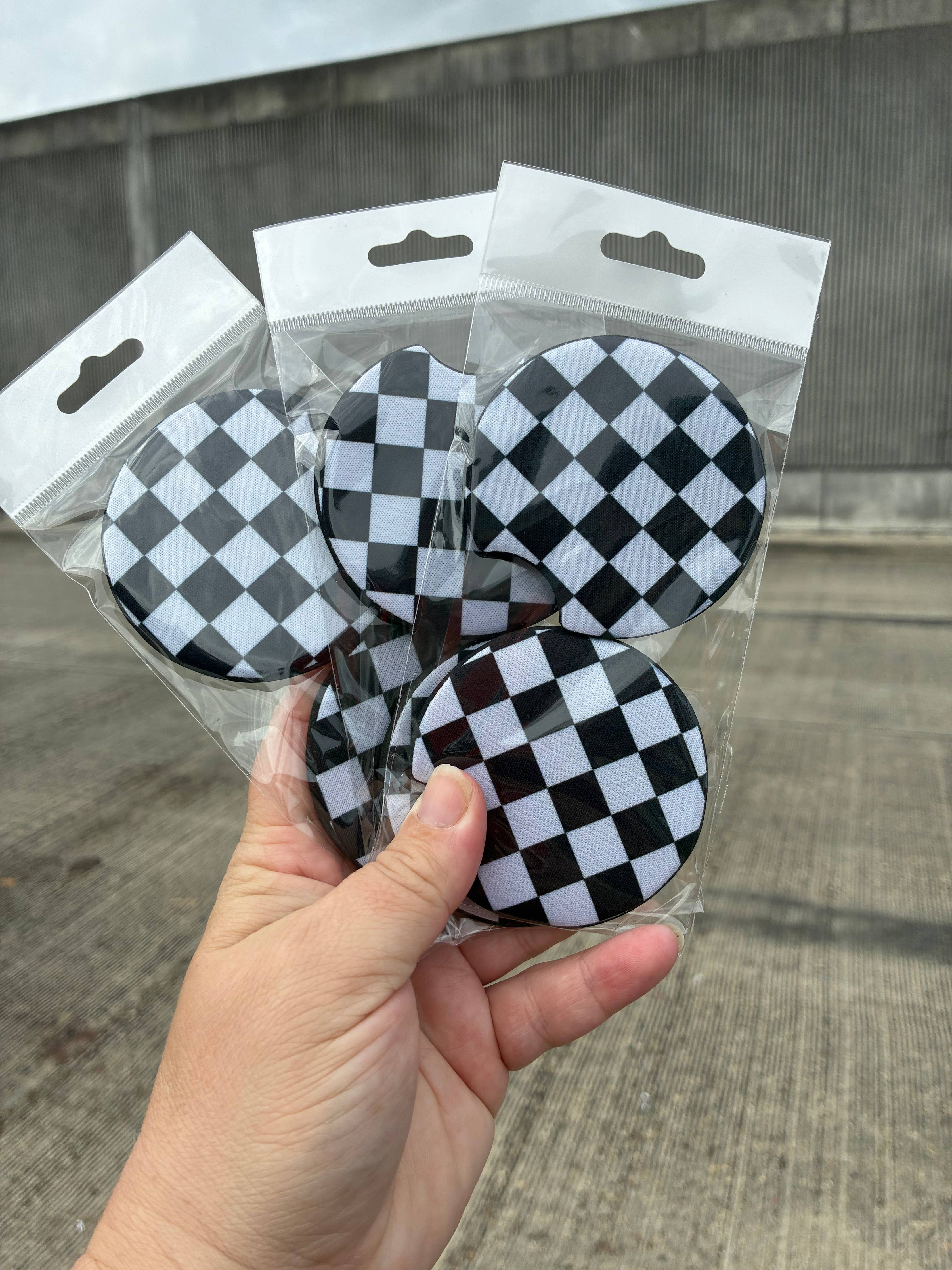 Checkered black and white car coasters